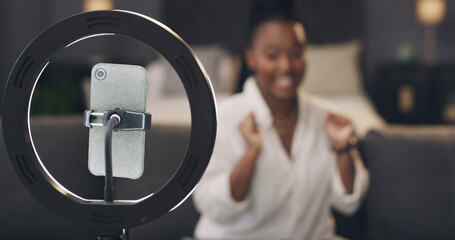 Phone, ring light and recording with influencer in home for content creation, post or video on web. Person, smartphone and production for social media, live streaming or app in lounge at apartment
