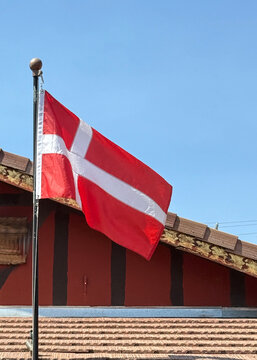 Danish Flag in front of a wooden building
