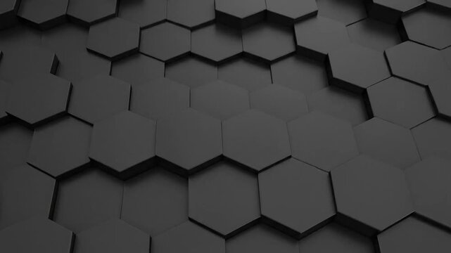 A grayscale, close-up shot of a dark surface formed by hexagonal tiles in varying heights