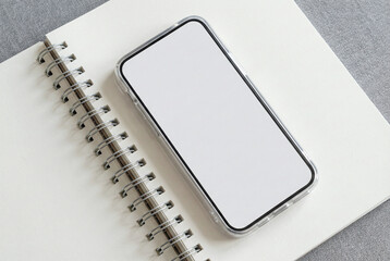 Blank Smartphone Screen Mockup on Spiral Notebook for App Design, Branding and Mobile UI Presentation