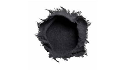A torn piece of black fabric with a ragged hole isolated on a black background