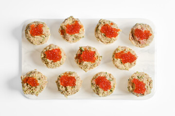 Delicious tuna tartlets topped with vibrant caviar on a clean white platter