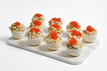 Delicious tuna tartlets served on a white platter for a festive gathering or meal