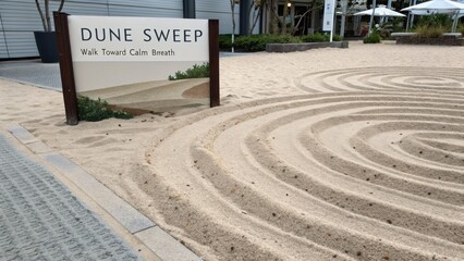 Serene Sand Patterns and Tranquil Signage in a Relaxing Outdoor Space for Mindfulness and Peaceful Retreat