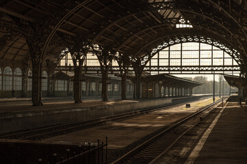 The vaults of the old railway station with deserted platforms and tracks.