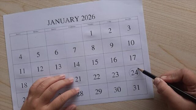 marking 24 January date on the calendar

