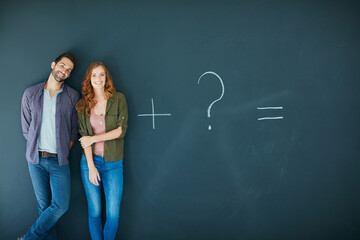 Happy couple, blackboard and relationship with question mark for equation on a dark background. Portrait, man and woman with smile, addition or problem solving for future goal or commitment on space