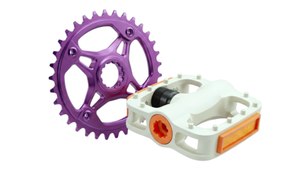 Purple Bicycle Chainring and Cream and Orange Pedals on White Background