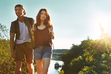 Hike, couple and people outdoor with smile, bonding together and romance in sightseeing adventure. Happy, man and woman in nature with love, connection and healthy relationship in trekking trip.