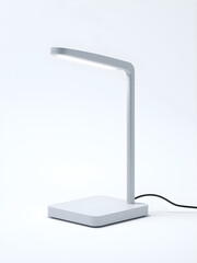 A white desk lamp with a black cord