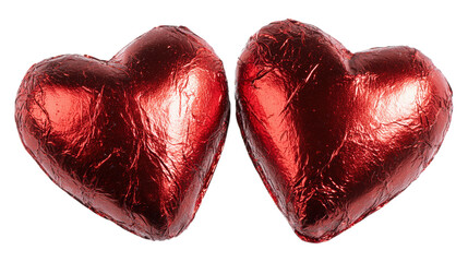 Pair of red heart chocolate in foil wrapper for valentine's day romantic celebration