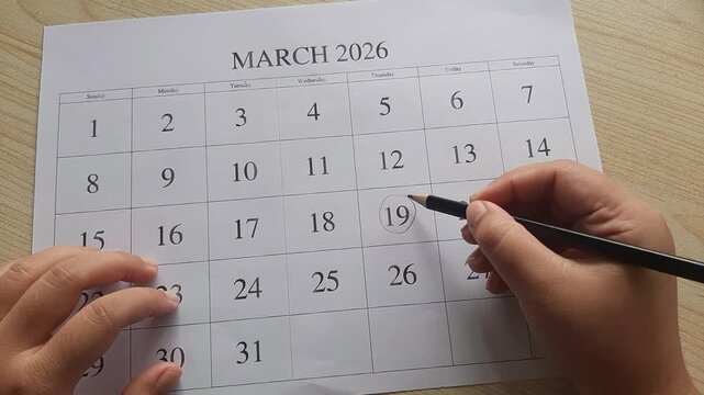 marking 19 March date on the calendar

