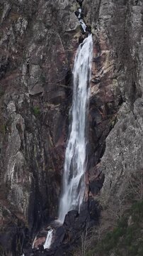 Vertical tallest waterfall in Portugal Frecha da Mizarela zoom angle