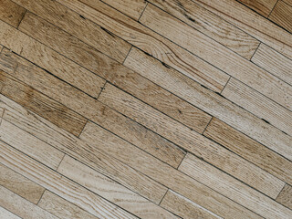 Fototapeta premium Light wooden floor with a diagonal pattern showcasing natural grain and texture, ideal for interior design, home decor, or flooring material applications