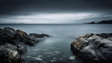 Rocky Coastal Shoreline at Dusk with Moody Overcast Light storm clouds over the sea
