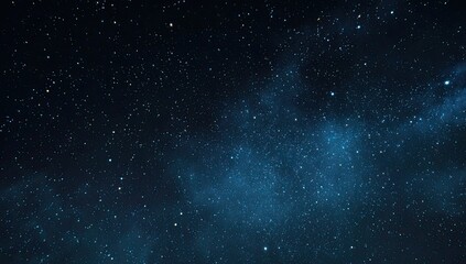Obraz premium A deep space vista, speckled with countless stars and nebulous wisps in cool blue hues