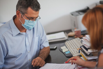 Accountant Consulting Client in Office