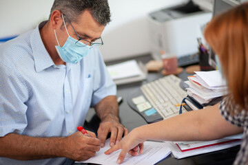 Accountant Consulting Client in Office