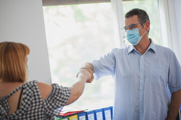 Accountant Consulting Client in Office