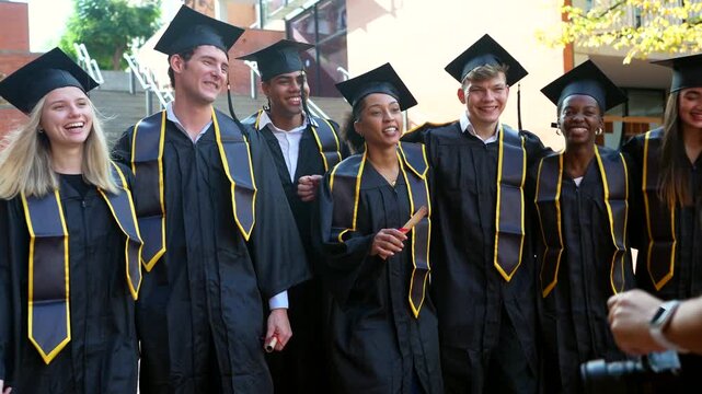 Diverse group of graduates celebrating university graduation day