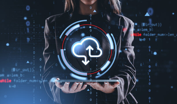 Businesswoman holding tablet with cloud computing icon and binar - Powered by Adobe