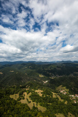 Fototapeta premium View to mountain and forest with cloudy sky