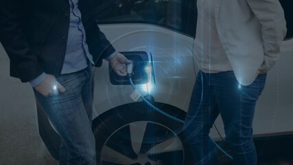 Animation of light beam, circles over caucasian couple at electric vehicle charging station