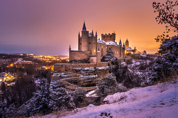 Alcazar of Segovia illuminated at dusk im winter, Spain © Daniel