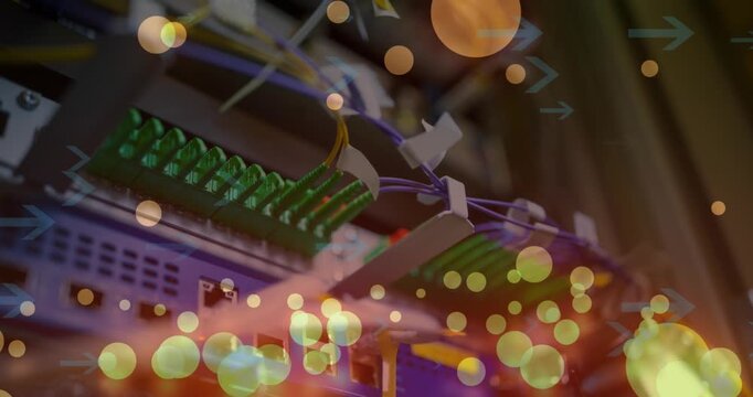 Animation of arrows and falling lens flares over wires connected to modems in background