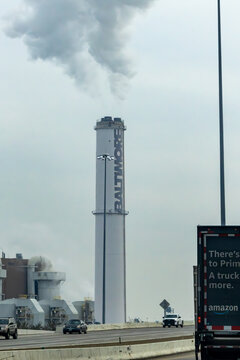 Baltimore, Maryland USA  A large iconic smokestack with a sign for Baltimore on an incineration plant from I-95.
