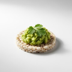 Rice cake topped with avocado and cilantro