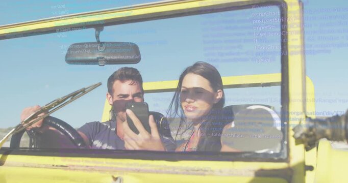 Driver grabbing phone copilot leaning sharing joy while moving travel icons floating on windshield