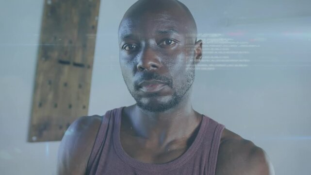 Animation of data processing over afrcan american fit man at gym