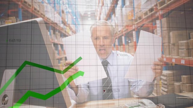 Animation of data processing over caucasian male supervisor reading documents at the warehouse
