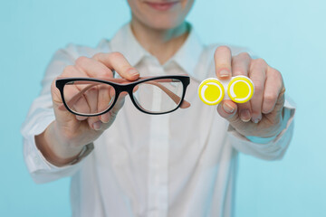 Choosing contact lenses or eyeglasses for vision correction, closeup banner