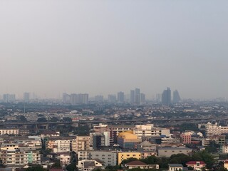 Fototapeta premium Urban Cityscape with Air Pollution and Smog in the Morning