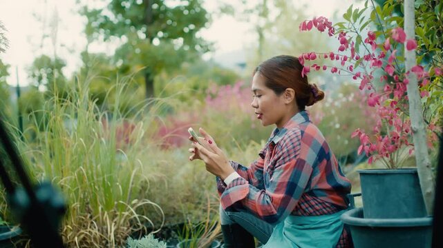 Young Woman Using Smart phone in Garden