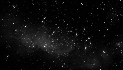 Fototapeta premium A mesmerizing grayscale depiction of a star-filled night sky. Nebulous clouds add depth to the celestial vista