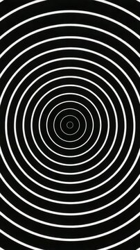 Hypnotic concentric circles creating an optical illusion against a black background