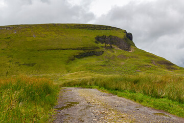 a view from the valley up to the peak of the famous ben bulben mountain in sligo at a cloudy summer day, ireland