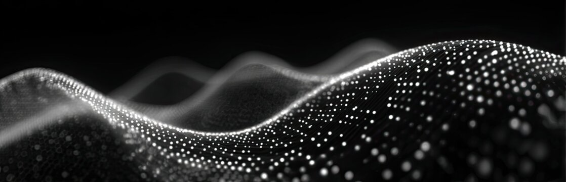 Abstract grayscale image showing a wave-like pattern created by glowing dots against a dark backdrop