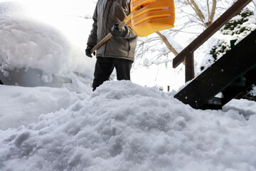 Man is removing snow after the snowfall.