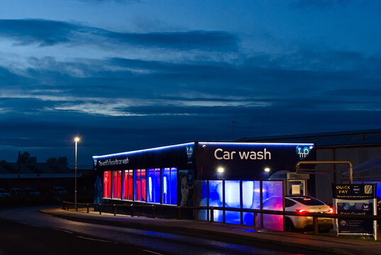 IMO Car wash on Redstone Ind. estate lit up after sundown. Boston UK. Dec 14, 2025