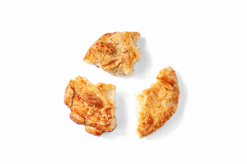 Broken cookies. Pieces of cookies on a white background. Top view