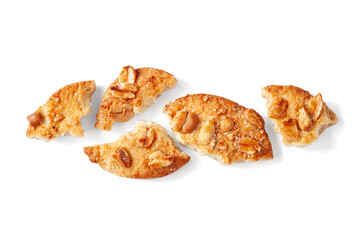 Broken cookies. Close-up of cookie pieces on a white background. View from above