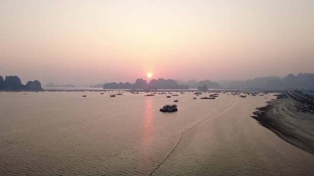 Aerial sunset over fishing boat harbor at Bai Tu Long Bay, Cam Pha,Viet Nam