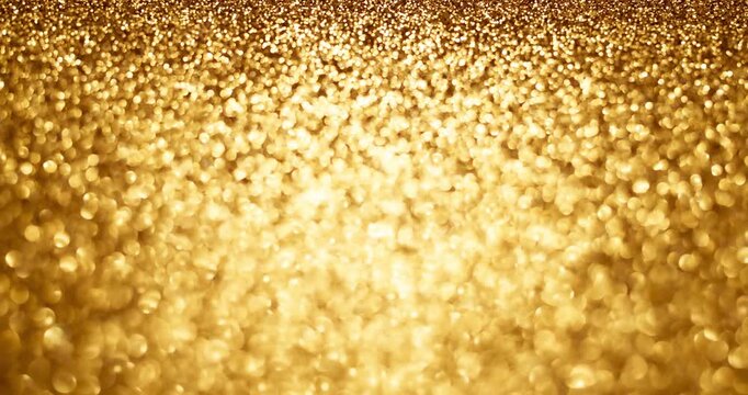 Warm golden glitter bokeh in stop-motion style, sparkling luxury abstract backdrop for holidays, celebrations, and elegant titles or overlays.