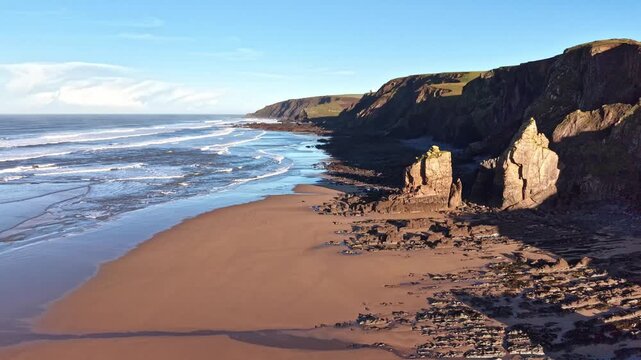 Spectacular morning light shines on Sandymouth Bay beach in mid January