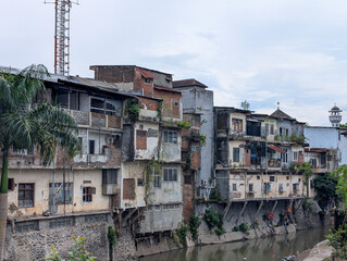 Multi-storey building with buildings jutting out towards the river