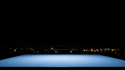 Naklejka premium Sleek illuminated blue platform glowing in darkness, with a blurred distant city lights backdrop, forming a modern abstract stage for innovative concepts and future presentations